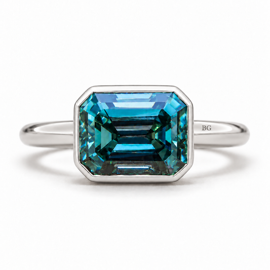 4 CT blue emerald cut moissanite east-west bezel engagement ring in white gold