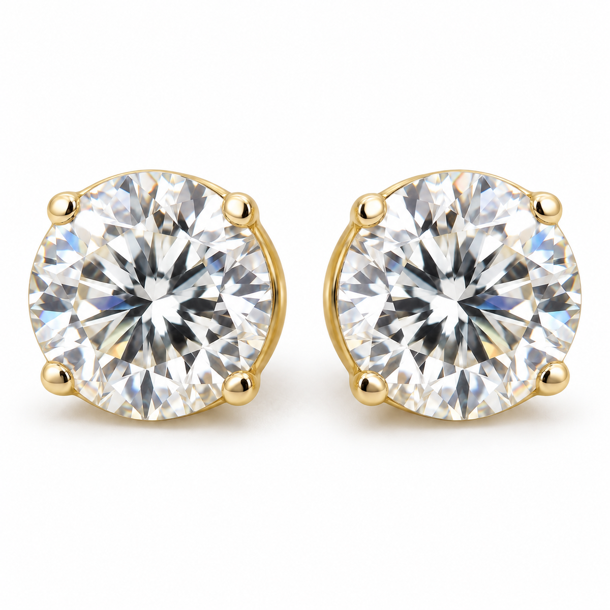 4 TCW round moissanite four prong stud earrings in yellow gold