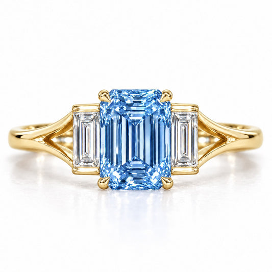 Blue Emerald Cut Lab Grown Diamond Engagement Ring - Trapezoid Three Stone in yellow gold, front view