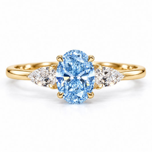 Blue Oval Cut Lab Grown Diamond Engagement Ring - Pear Side Stones in yellow gold, front view