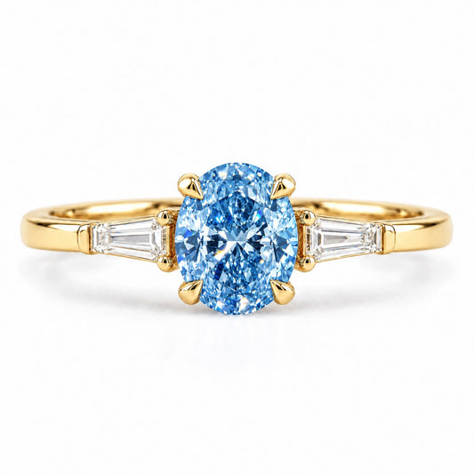 Blue Oval Cut Lab Grown Diamond Engagement Ring - Tapered Baguettes in yellow gold, front view