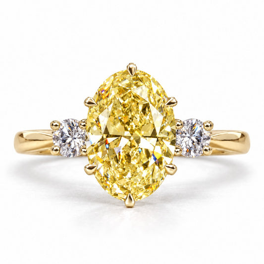 Yellow Oval Cut Lab Grown Diamond Engagement Ring - Three Stone in yellow gold, front view