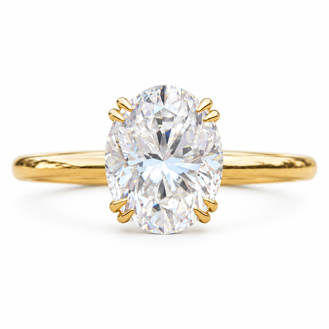 Oval moissanite solitaire engagement ring in yellow gold