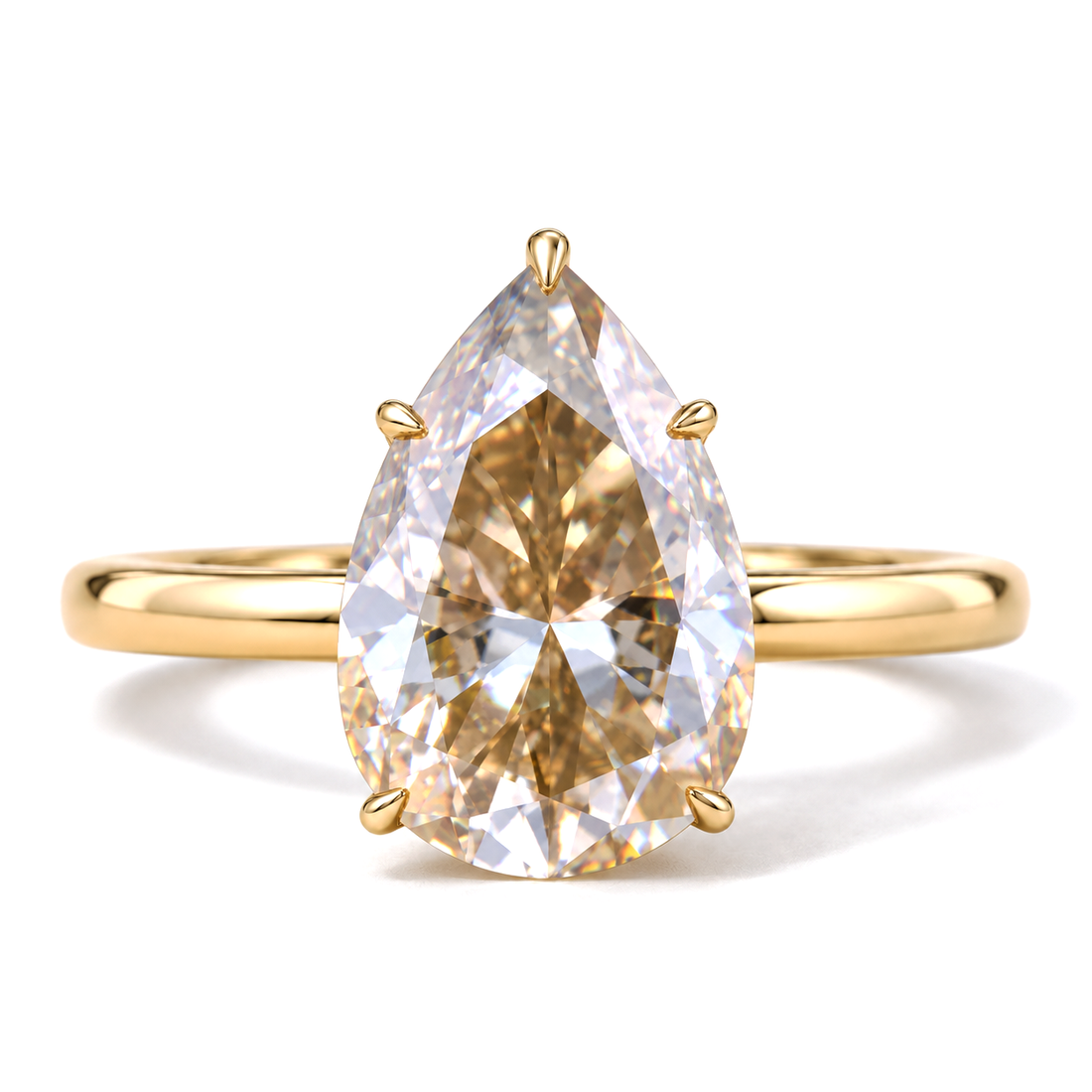 Champagne pear moissanite engagement ring in yellow gold
