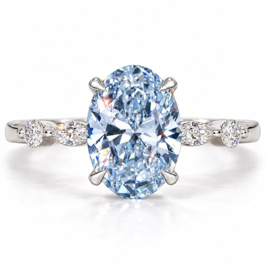 Blue oval lab grown diamond engagement ring with marquise and round accents in white gold
