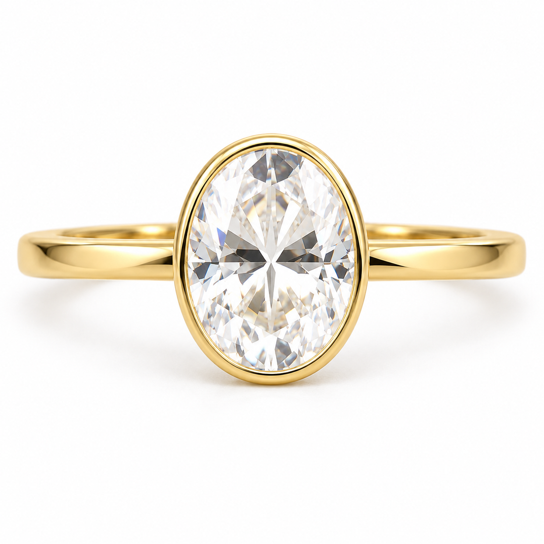 Oval moissanite bezel solitaire ring in yellow gold
