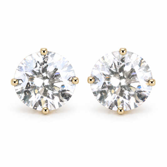 Round moissanite stud earrings in yellow gold four-prong settings