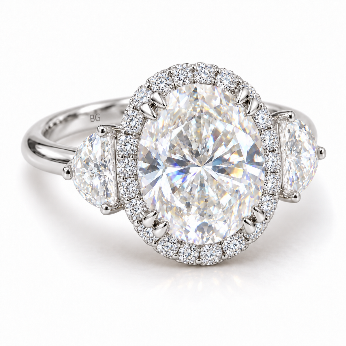 Oval moissanite halo engagement ring with half-moon side stones in white gold