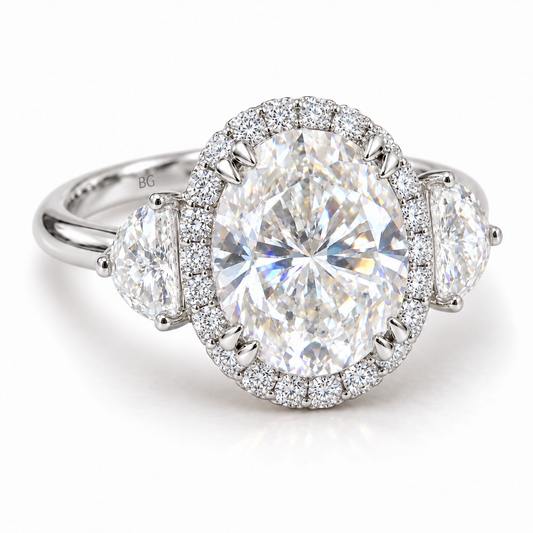 Oval moissanite halo engagement ring with half-moon side stones in white gold