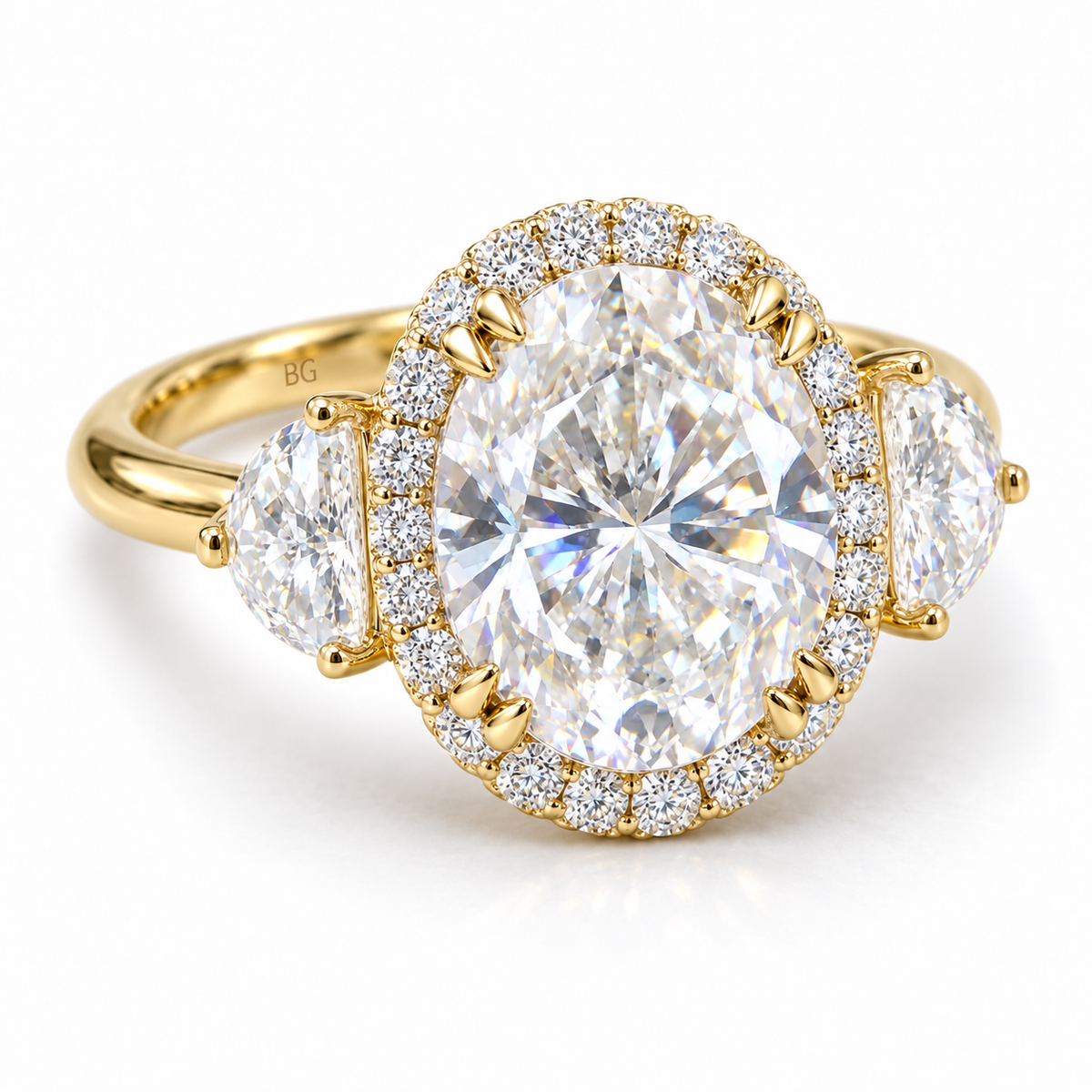 Oval moissanite halo engagement ring with half-moon side stones in yellow gold