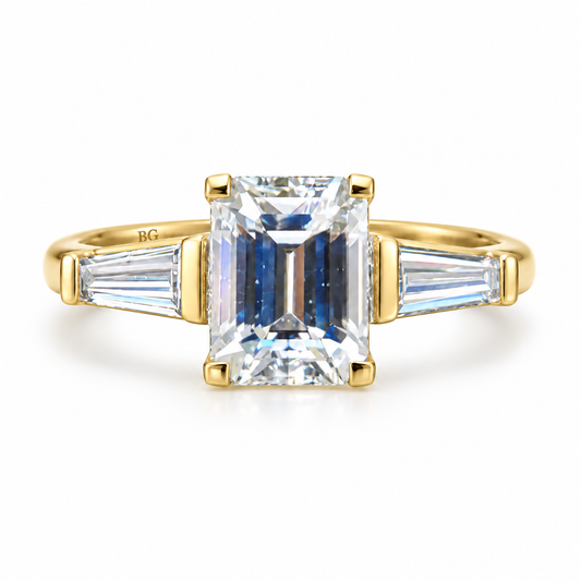 2.52 CT emerald cut moissanite engagement ring with tapered baguette side stones in yellow gold