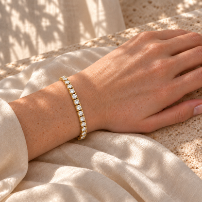 Round moissanite tennis bracelet worn on the wrist