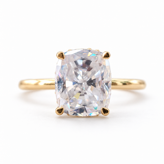 Elongated cushion moissanite hidden halo engagement ring in yellow gold