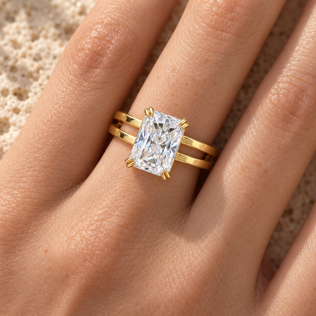 Radiant moissanite dual band ring in yellow gold worn on the hand