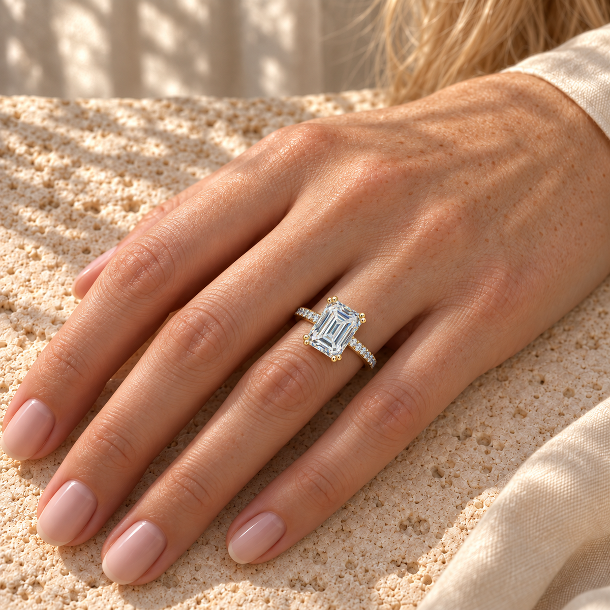 4 CT Colorless Emerald Cut Moissanite Engagement Ring - Yellow gold - worn on the hand
