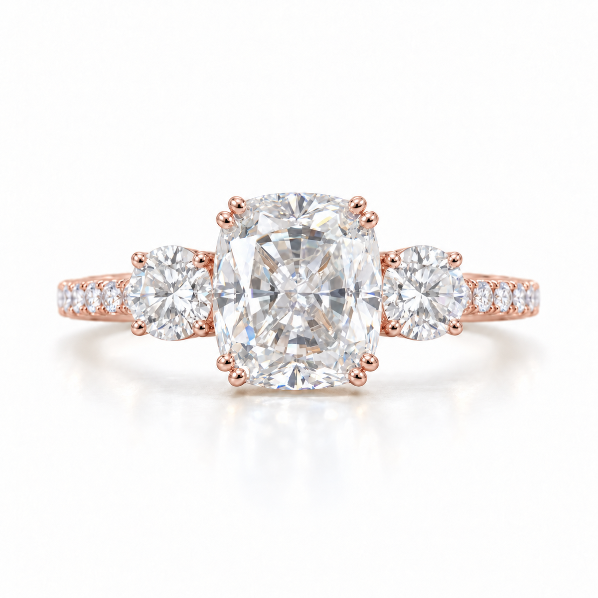 Elongated cushion moissanite three stone engagement ring in rose gold
