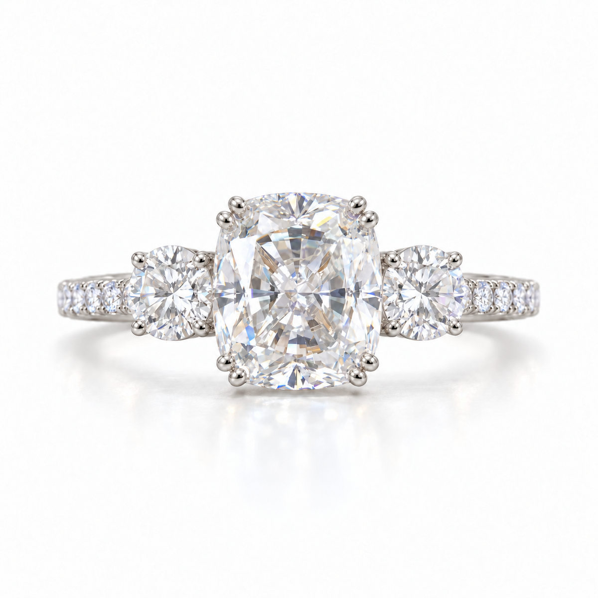 Elongated cushion moissanite three stone engagement ring in white gold