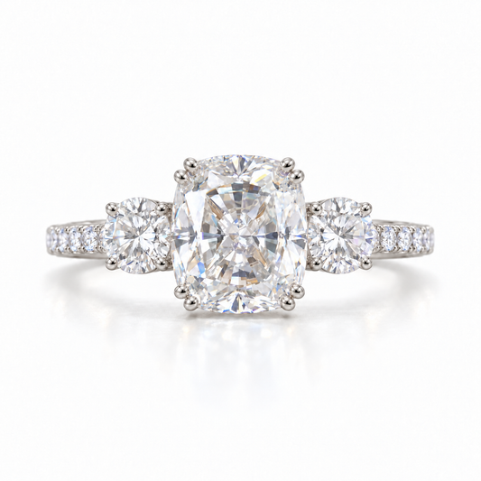 Elongated cushion moissanite three stone engagement ring in white gold