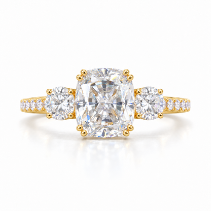 Elongated cushion moissanite three stone engagement ring in yellow gold