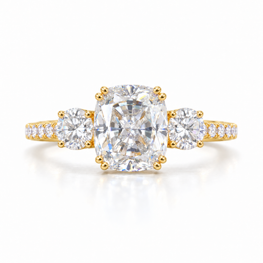 Elongated cushion moissanite three stone engagement ring in yellow gold