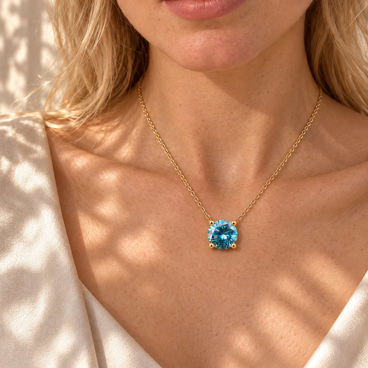 Round blue moissanite pendant necklace worn by the Bhumi model