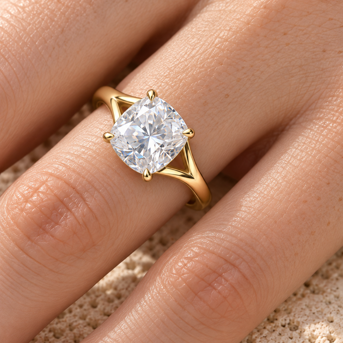 Cushion moissanite split shank solitaire ring worn on hand, yellow gold