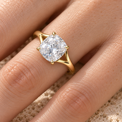 Cushion moissanite split shank solitaire ring worn on hand, yellow gold