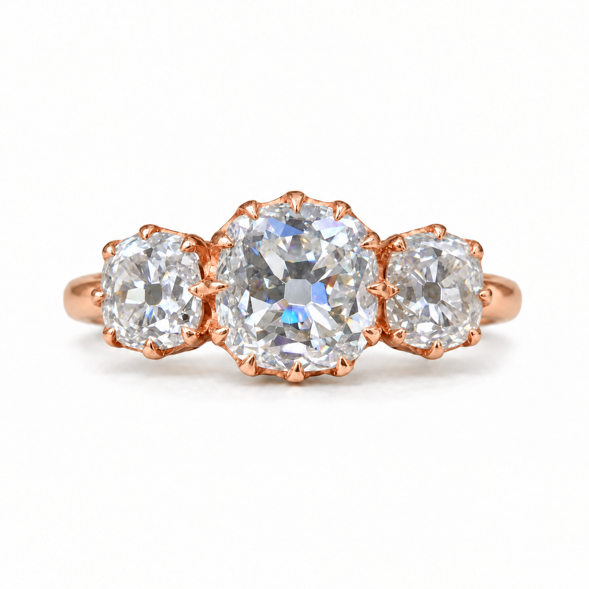 5 TCW old mine cushion moissanite three stone engagement ring with claw prongs in rose gold