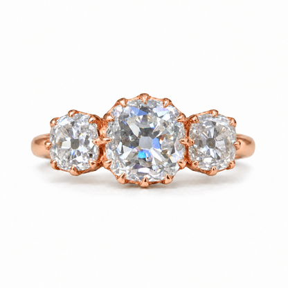 5 TCW old mine cushion moissanite three stone engagement ring with claw prongs in rose gold