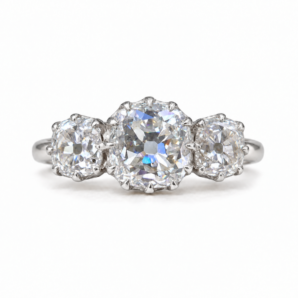 5 TCW old mine cushion moissanite three stone engagement ring with claw prongs in white gold