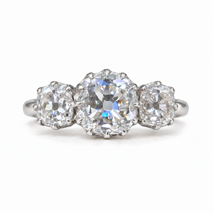 5 TCW old mine cushion moissanite three stone engagement ring with claw prongs in white gold