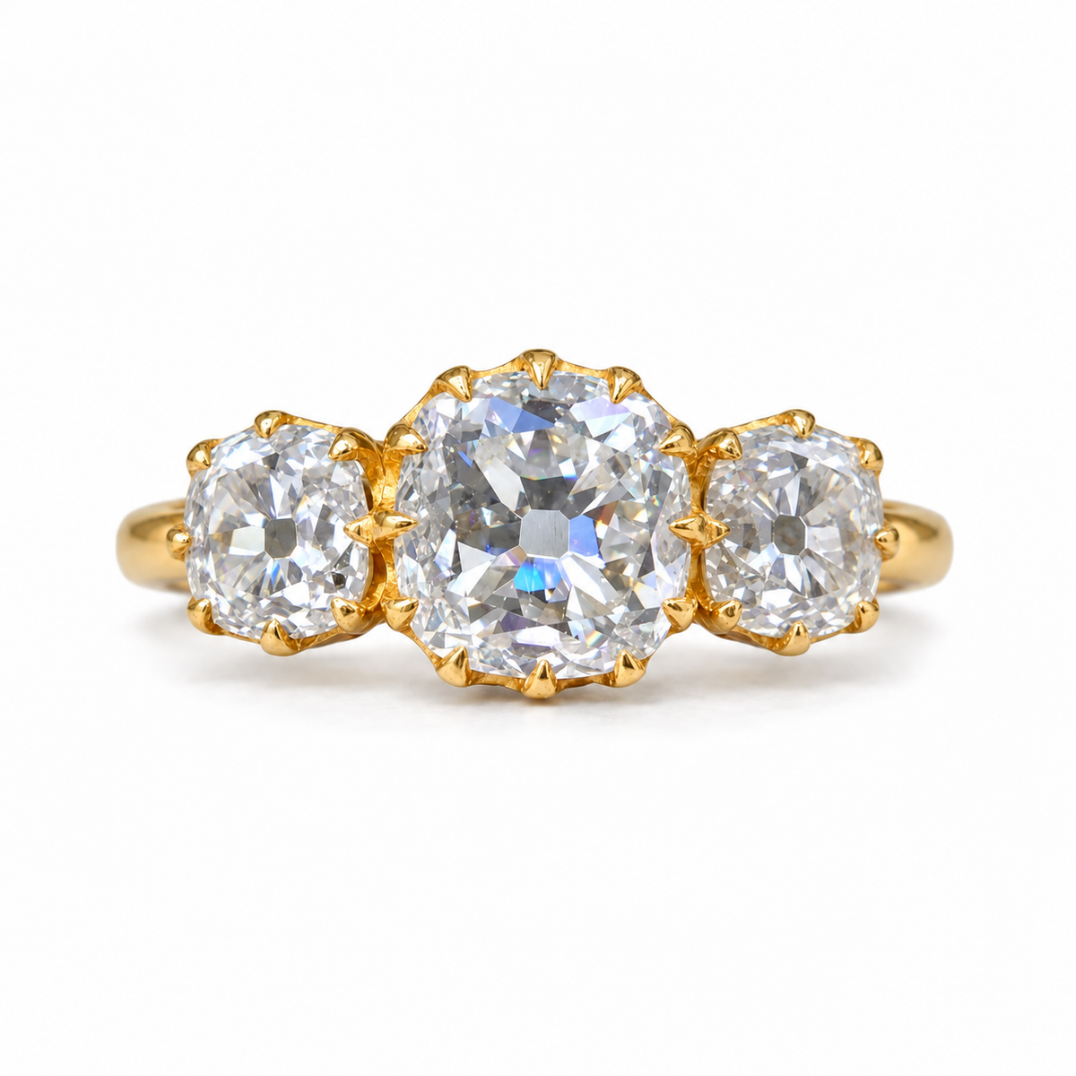 5 TCW old mine cushion moissanite three stone engagement ring with claw prongs in yellow gold