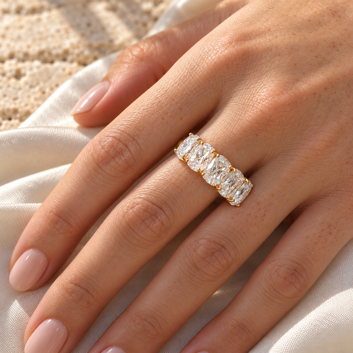 Five stone elongated cushion moissanite band worn on the hand