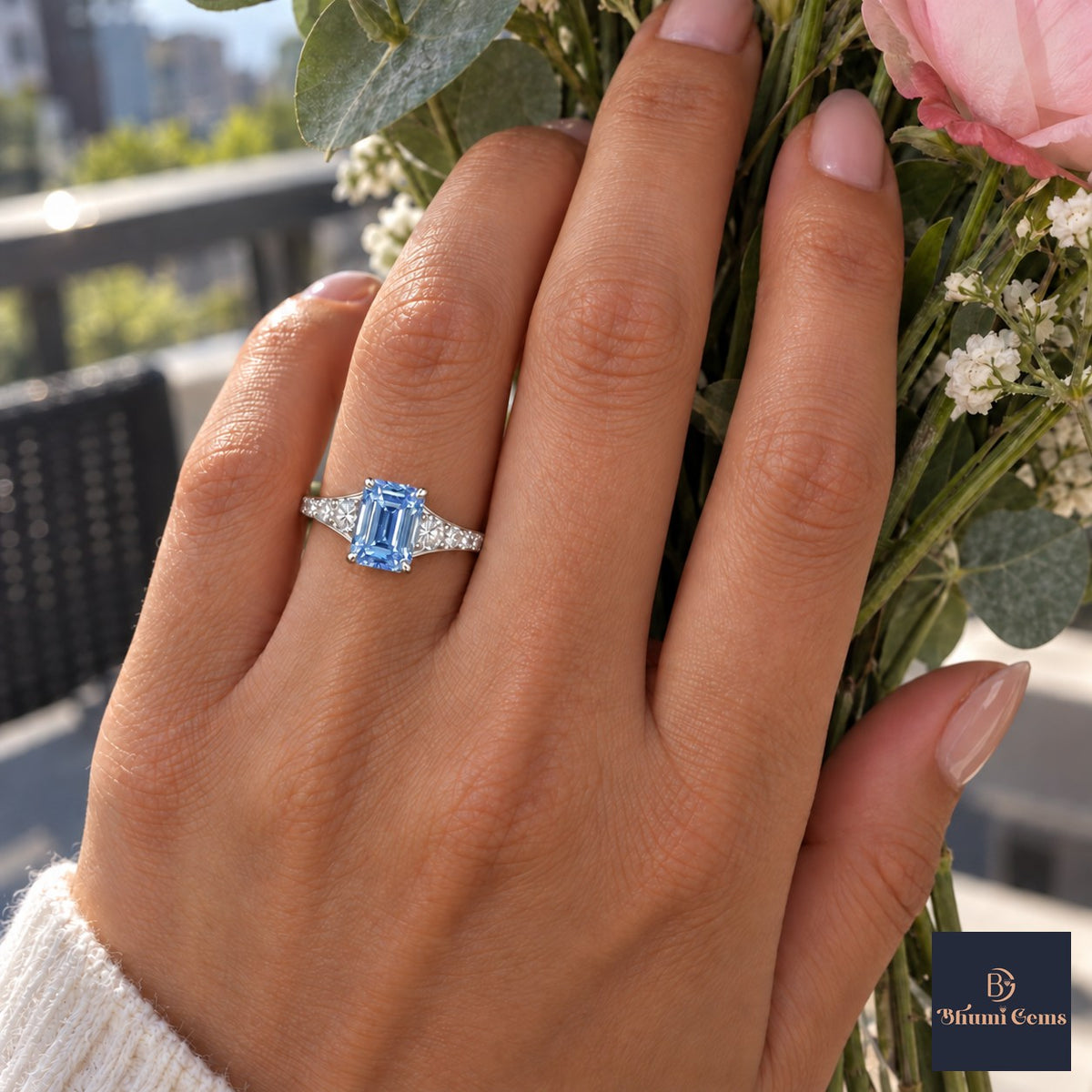 Blue Emerald Cut Lab Grown Diamond Engagement Ring - Graduated Pave Shoulders in white gold, worn on the hand
