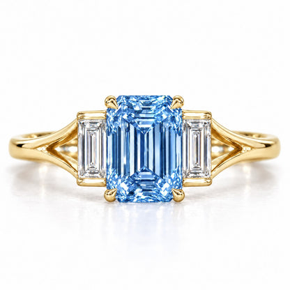 Blue Emerald Cut Lab Grown Diamond Engagement Ring - Trapezoid Three Stone in yellow gold, front view