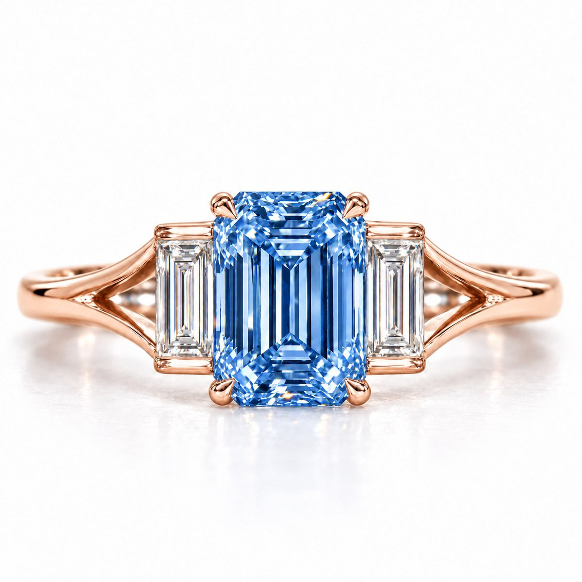 Blue Emerald Cut Lab Grown Diamond Engagement Ring - Trapezoid Three Stone in rose gold, front view