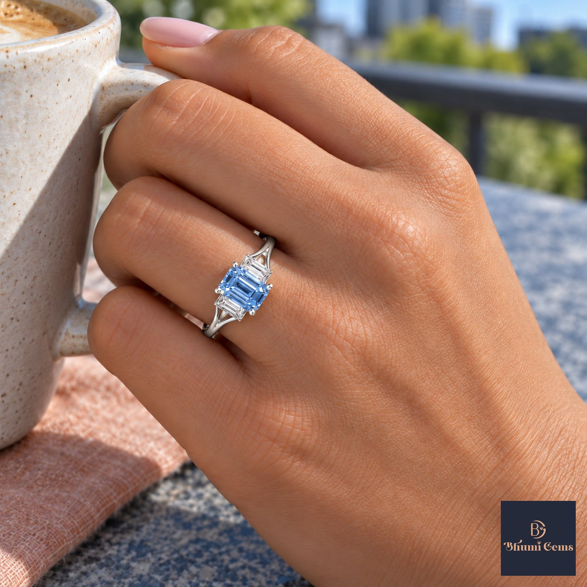 Blue Emerald Cut Lab Grown Diamond Engagement Ring - Trapezoid Three Stone in white gold, on the hand