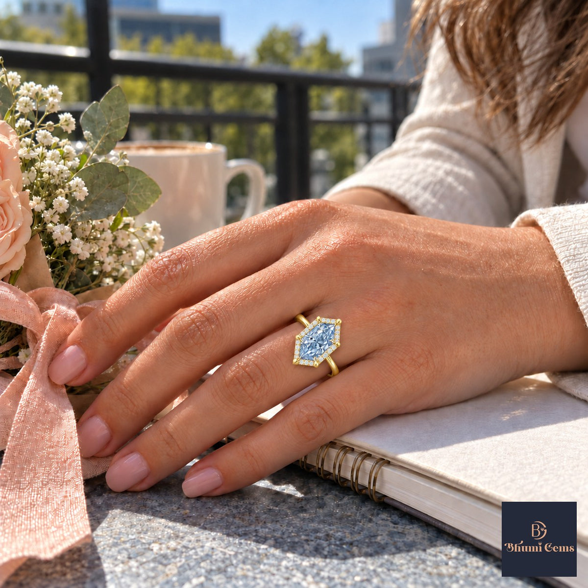 Blue Hexagon Cut Lab Grown Diamond Engagement Ring - Halo in yellow gold, worn on the hand