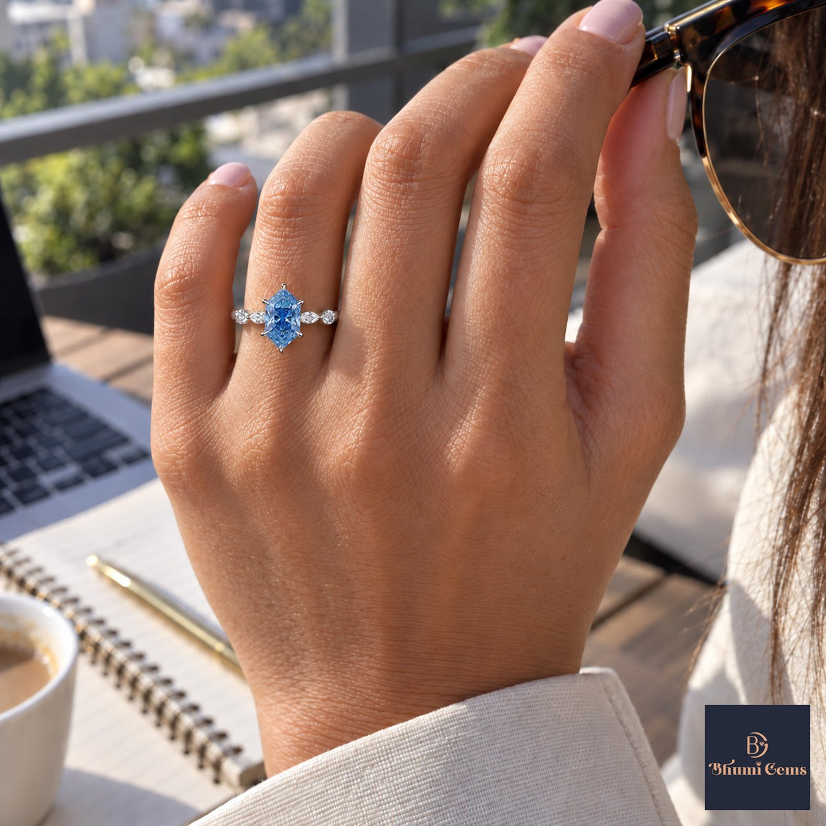 Blue Hexagon Cut Lab Grown Diamond Engagement Ring - Marquise and Round Accents in white gold, worn on the hand