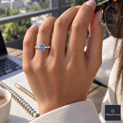 Blue Hexagon Cut Lab Grown Diamond Engagement Ring - Marquise and Round Accents in rose gold, worn on the hand