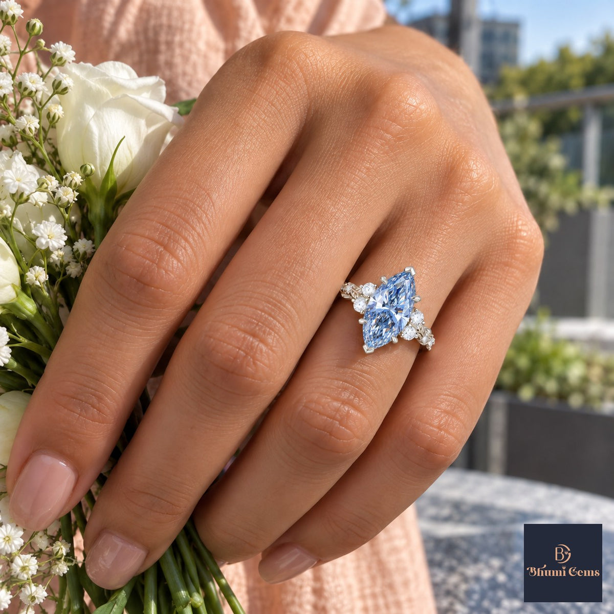 Blue Marquise Cut Lab Grown Diamond Engagement Ring - Cluster Vine Band in white gold, on the hand