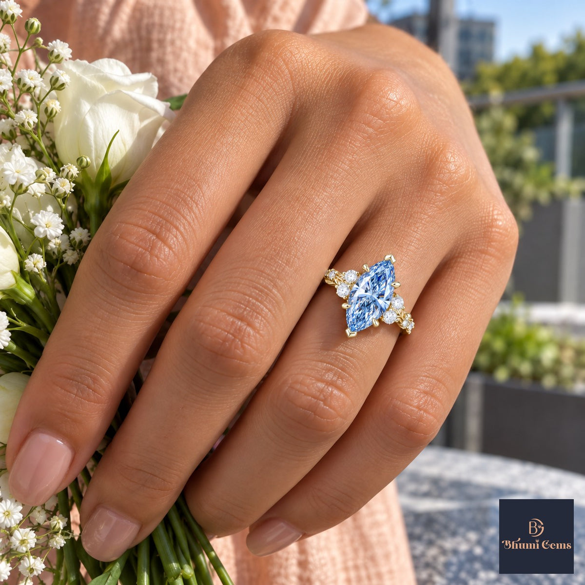Blue Marquise Cut Lab Grown Diamond Engagement Ring - Cluster Vine Band in yellow gold, on the hand