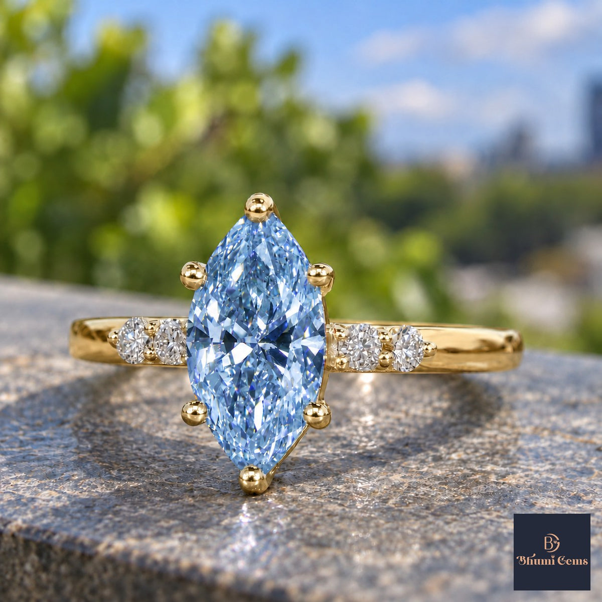 Blue Marquise Cut Lab Grown Diamond Engagement Ring - Round Accents in yellow gold, close-up