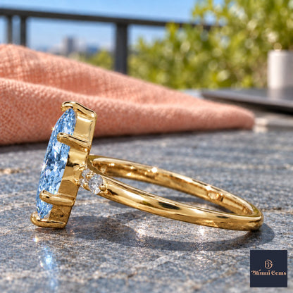 Blue Marquise Cut Lab Grown Diamond Engagement Ring - Round Accents in yellow gold, side view