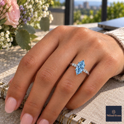 Blue Marquise Cut Lab Grown Diamond Engagement Ring - Round Accents in white gold, worn on the hand