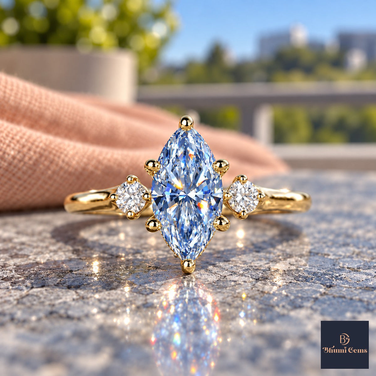 Blue Marquise Cut Lab Grown Diamond Engagement Ring - Three Stone in yellow gold, close-up
