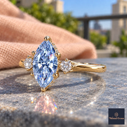 Blue Marquise Cut Lab Grown Diamond Engagement Ring - Three Stone in yellow gold, side view
