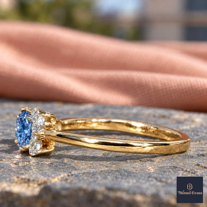 Blue Oval Cut Lab Grown Diamond Engagement Ring - Asymmetric Cluster in yellow gold, side view