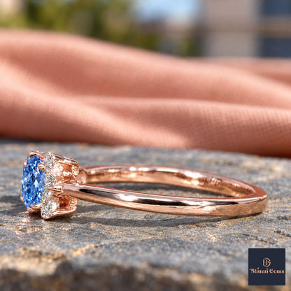 Blue Oval Cut Lab Grown Diamond Engagement Ring - Asymmetric Cluster in rose gold, side view