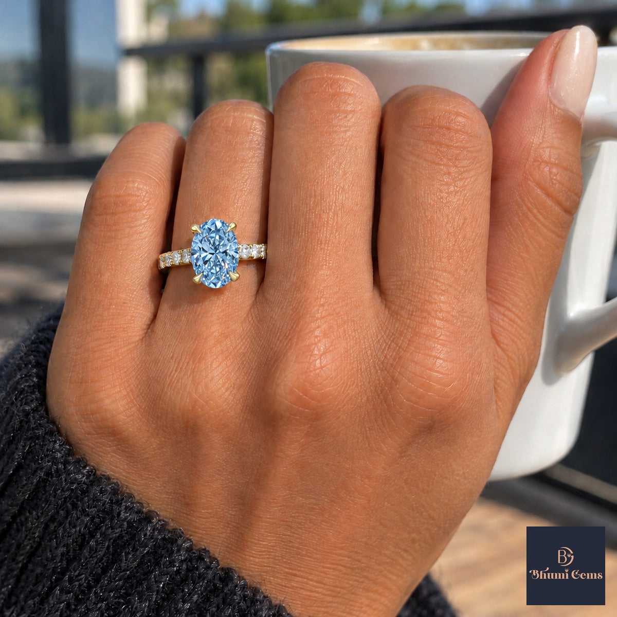 Blue Oval Cut Lab Grown Diamond Engagement Ring - Cathedral Pave Band in yellow gold, on the hand